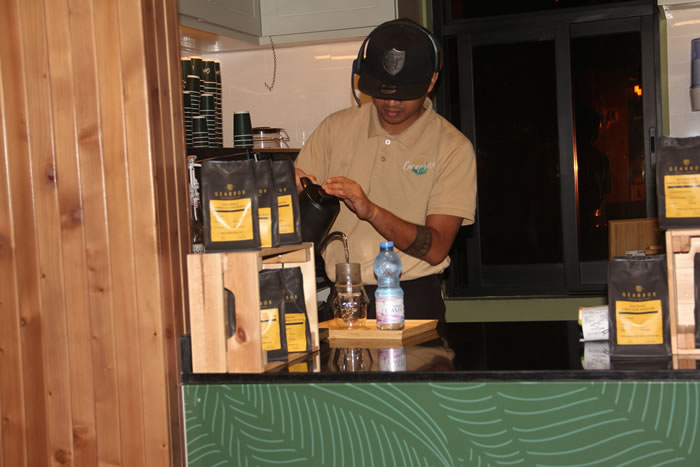 Barista in action with headset	